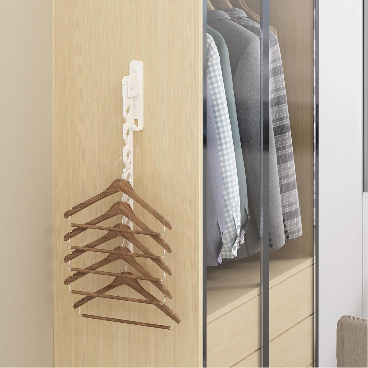 Drying rack folded flat on a wardrobe side holding wooden hangers