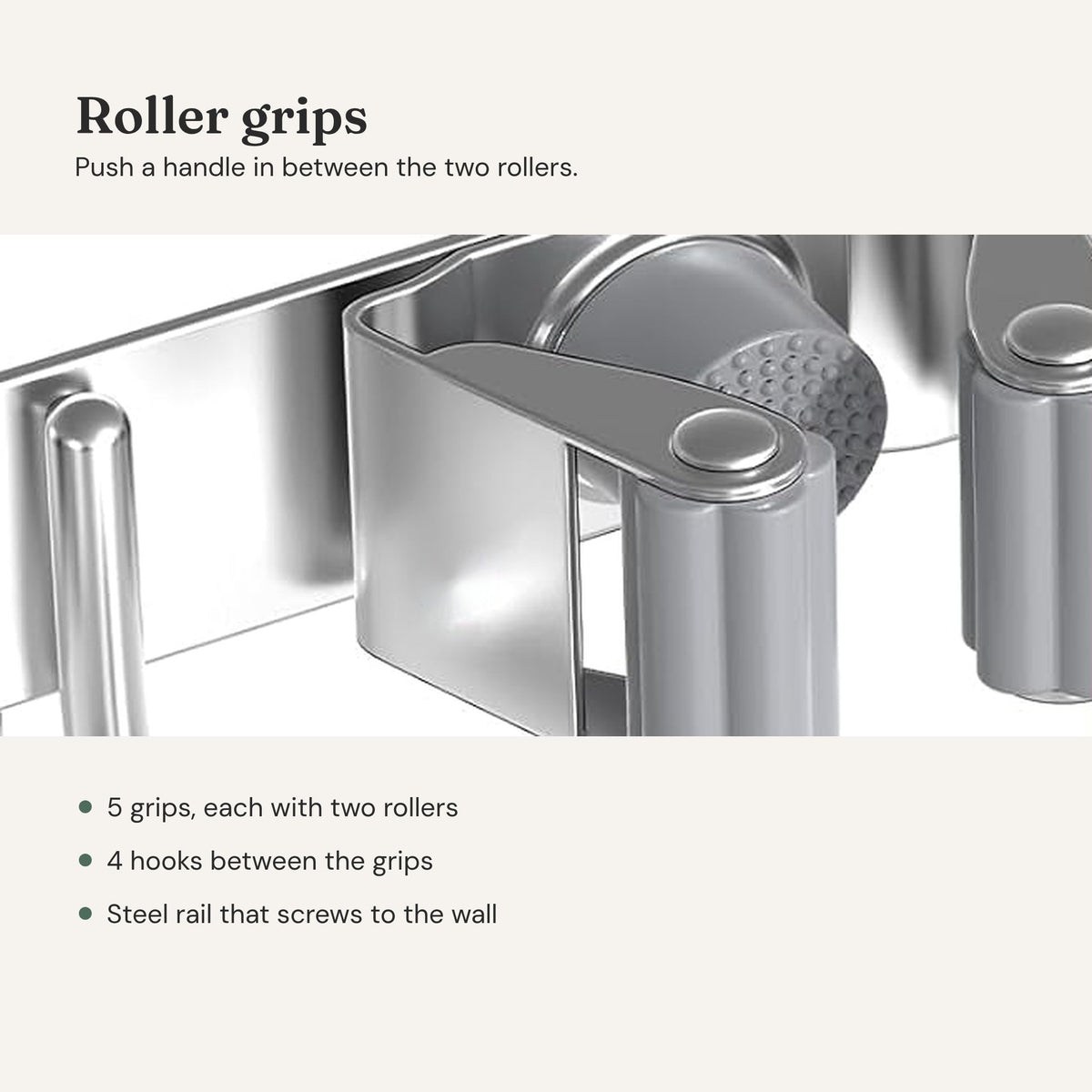 Broom holder close-up: a grip with two gray rollers on a steel rail, next to a hook.