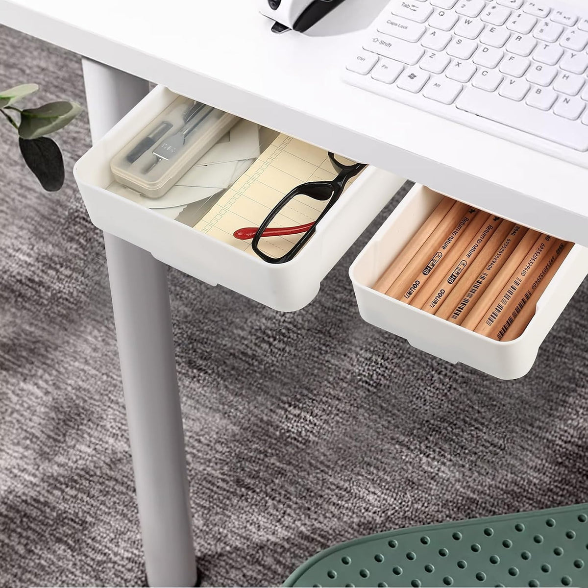 Under-desk drawer 2-pack: two white drawers mounted under a desk, holding pencils, notes and glasses.