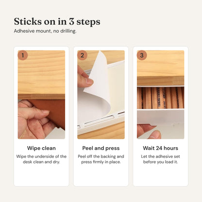 How it installs: wipe the desk underside, peel the backing and press firmly, wait 24 hours before loading.