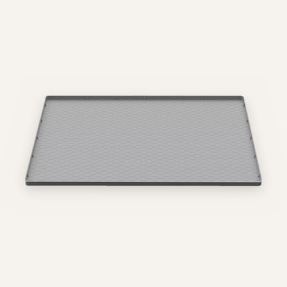 Under-sink leak mat: gray silicone tray with a raised edge and hexagon texture, shown alone.
